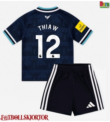 Newcastle United Malick Thiaw #12 Borta Kläder Barn 2026-27 Kortärmad (+ Korta byxor)